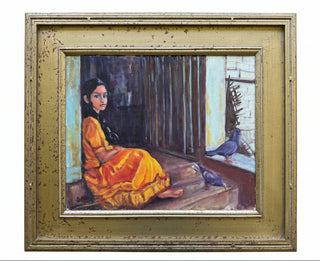 A framed painting depicting a seated woman in a bright yellow-orange dress on a wooden floor, with two pigeons near the window. The artwork is housed in a distressed gold frame and photographed against a gray tiled wall.